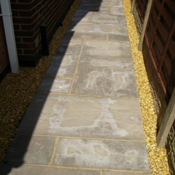 Paving showing lime bloom.