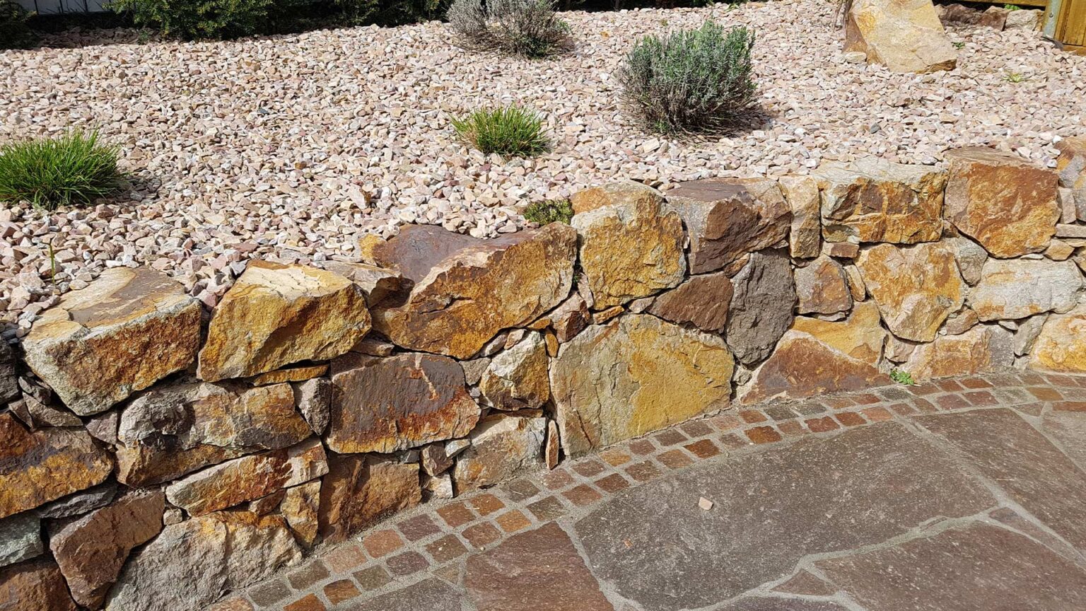 Large flat drystone retaining wall for the knee high garden tarrace