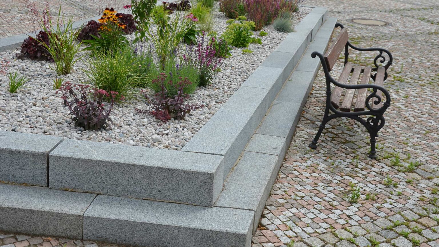 Granite blocks retaining raised bed