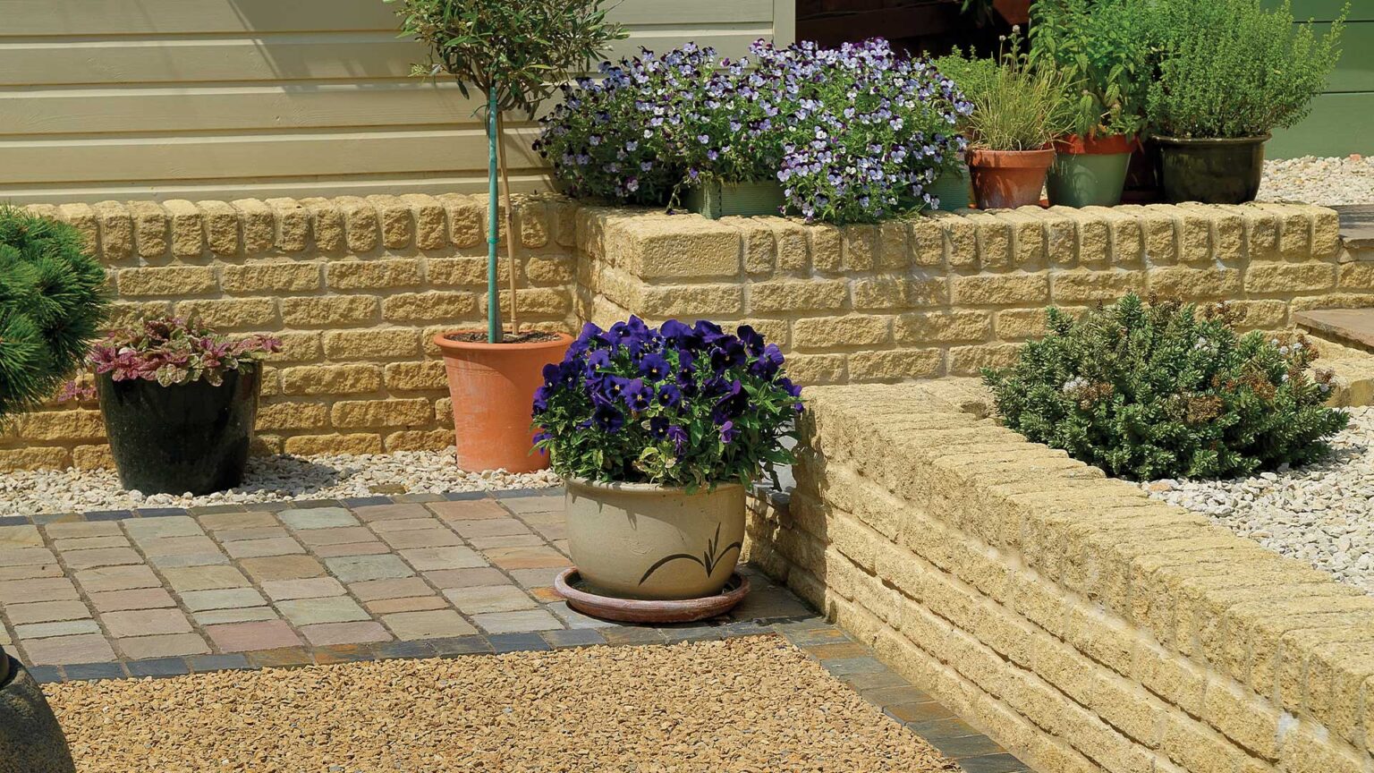 Golden Buff reconstituted stone knee walls (terrace and steps retaining walls)