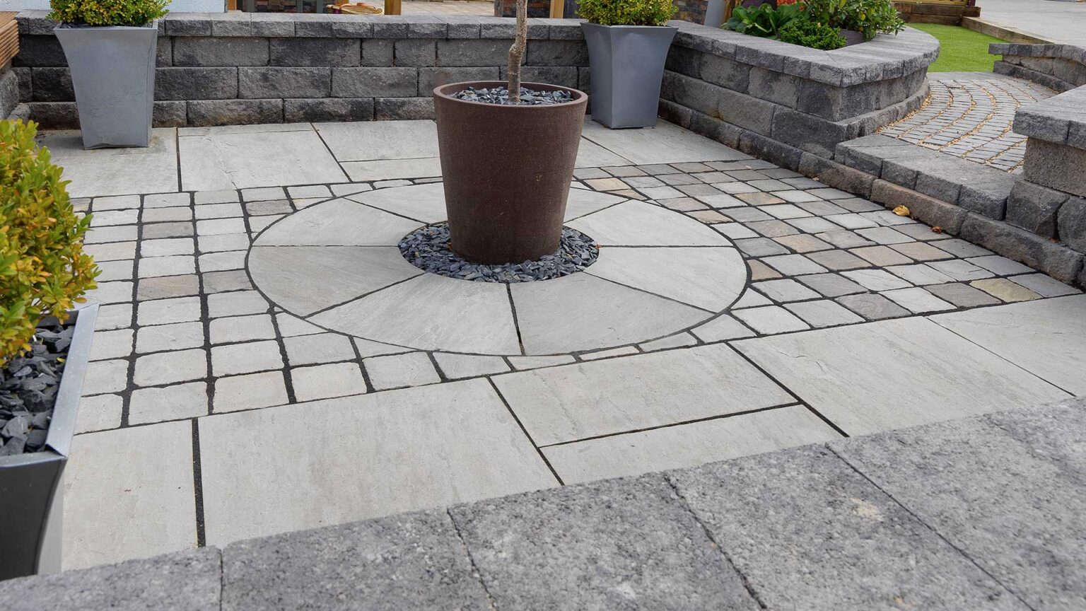 Reconstituted stone walling blocks used to create this patio's surrounding parapet wall.