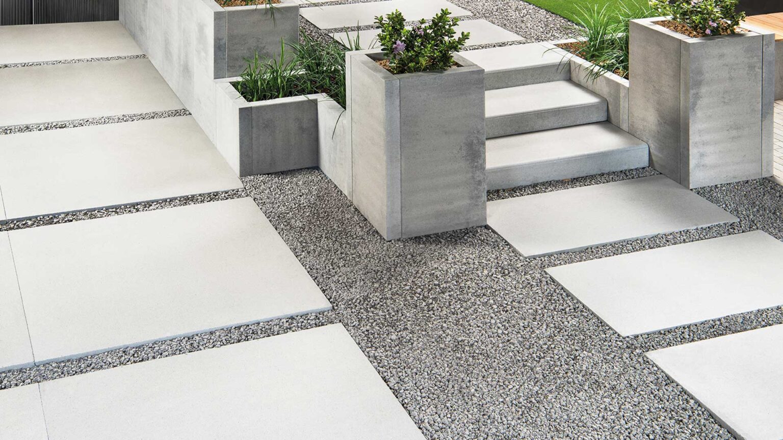 Style Walling Landscaping System used here to create pillar planters and raised bed in this modernist garden.