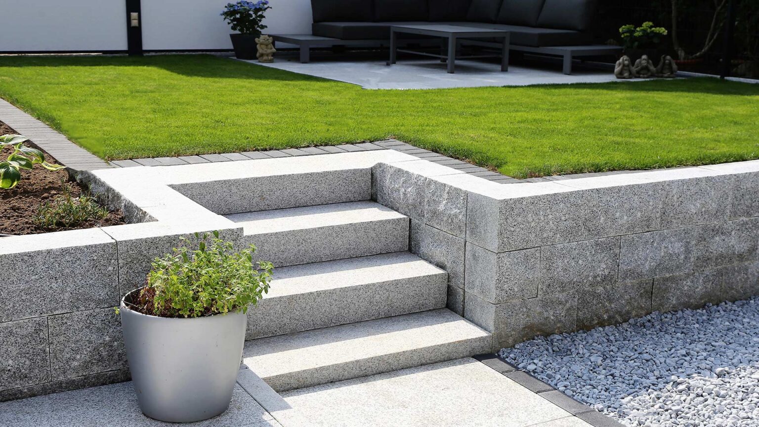 Sawn granite blocks are used for these garden steps and terrace retaining wall.