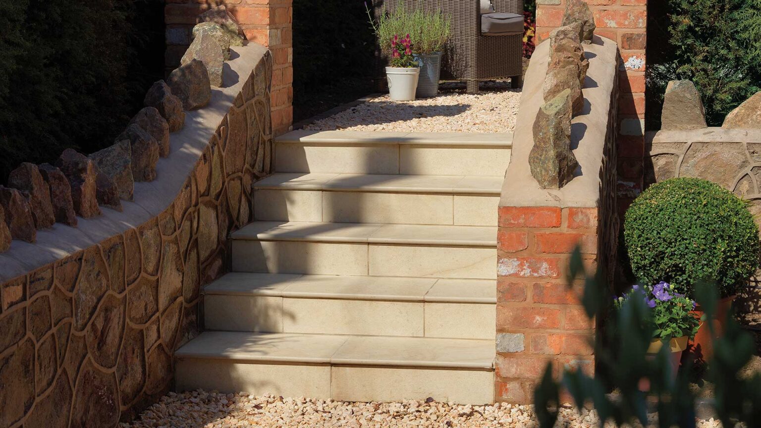 Brick & ragstone retaining walls and steps with Dolomite French limestone bullnose steps and risers