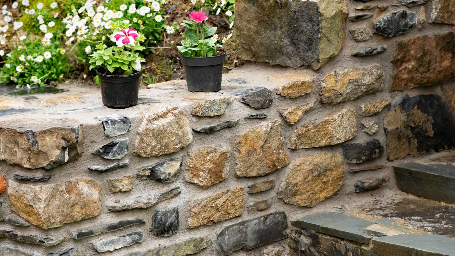 Irregular mixed sized stones with wide gauged pointing will create a rustic and vernacular feel.