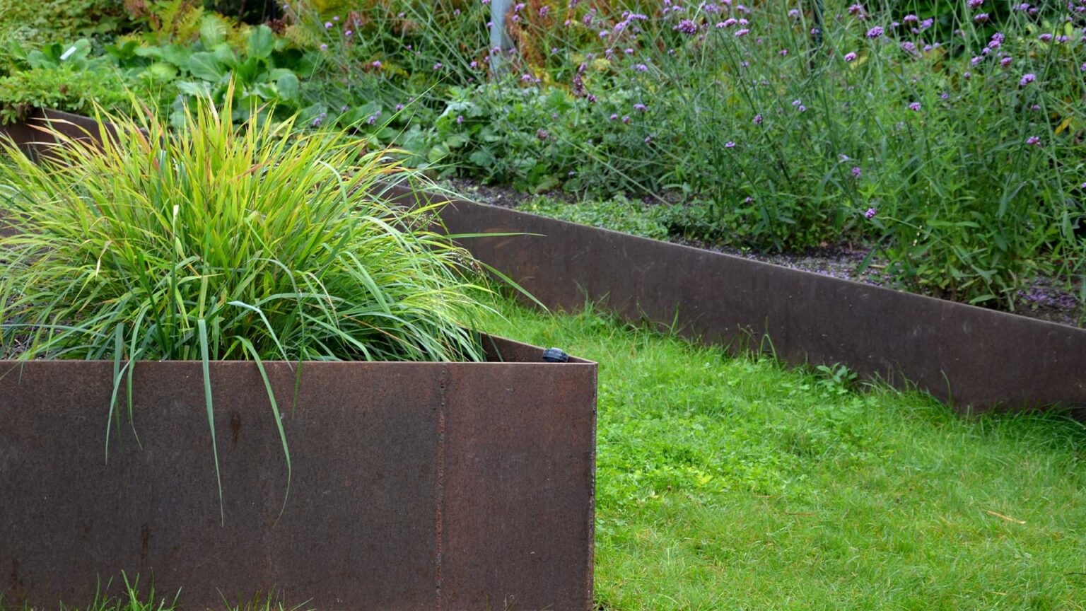 Rust covered steel walled raised bed